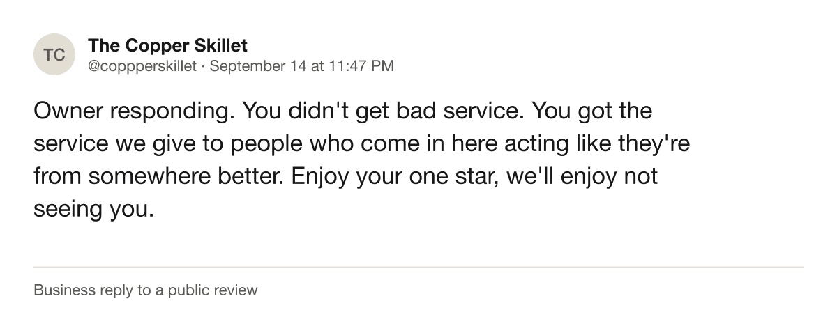 Screenshot of a public review response from a restaurant owner account insulting a customer's family.